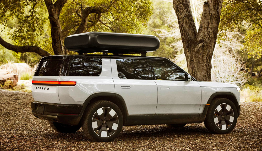 Rivian R2 in woods
